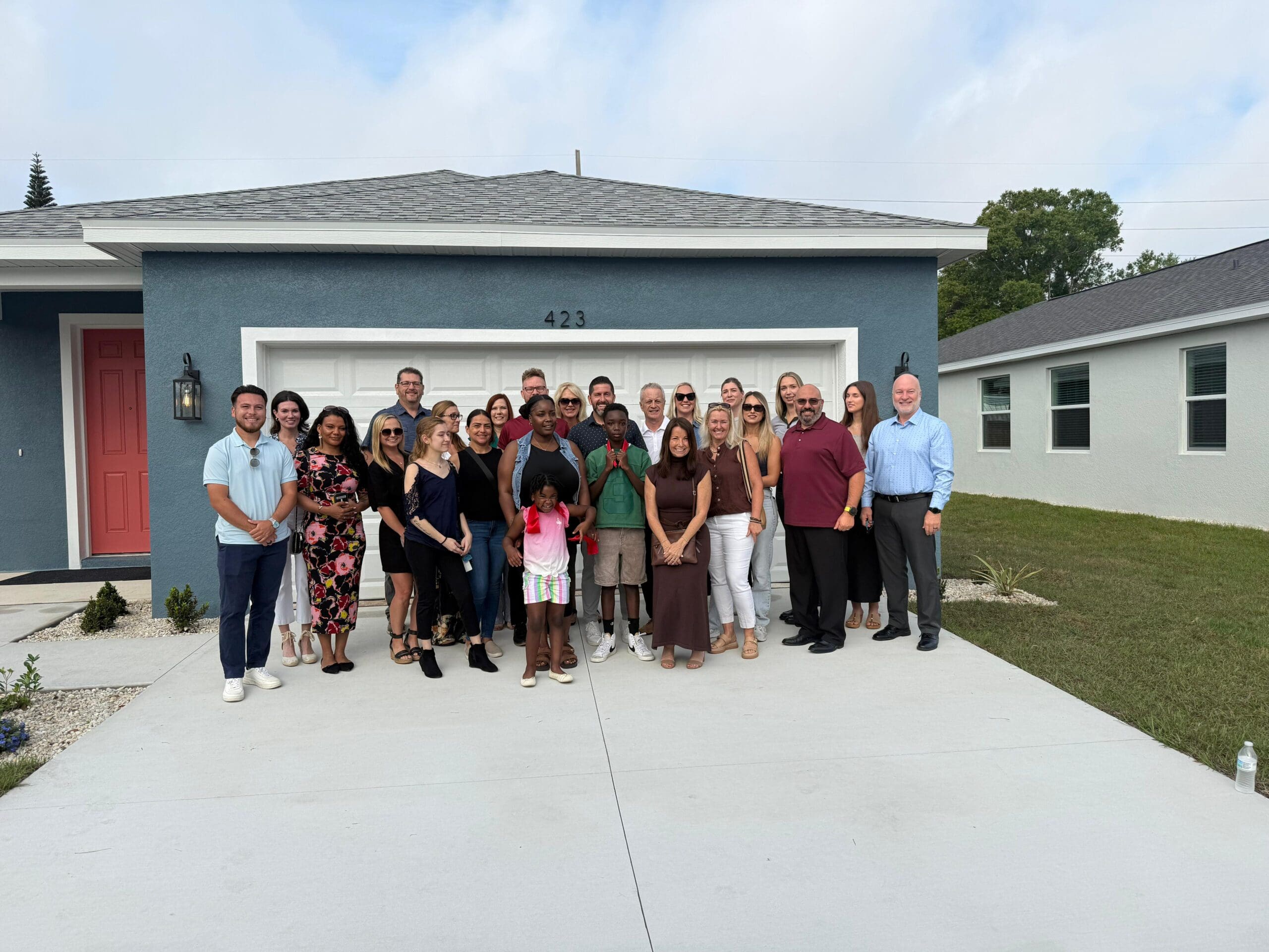 Zarghami Group team with Rasheeda and her family at the Block by Block Habitat for Humanity home build